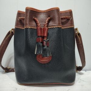 Dooney & Bourke Vintage Teton Black Leather Bucket‎ Bag with Brown Trim Tassel